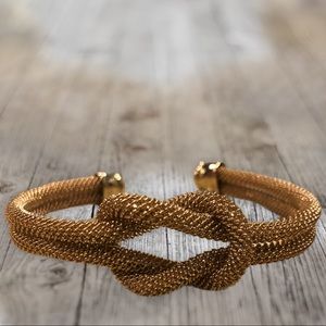 Gold toned knotted bangle